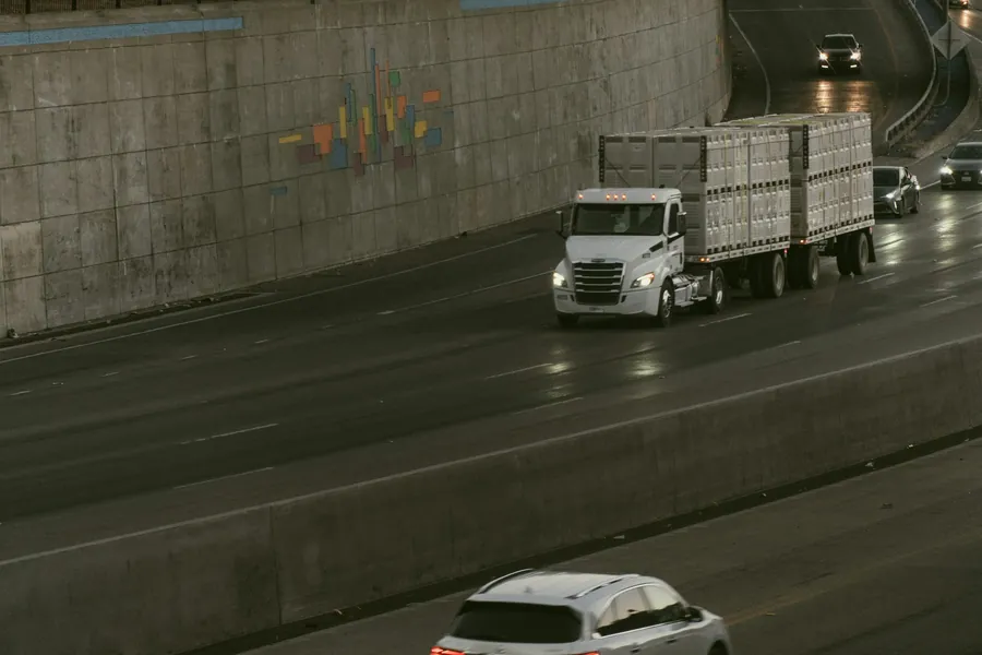 Truck carrying containers on a highway